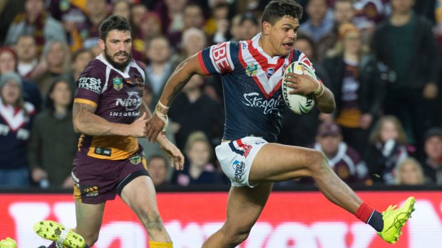 Escape act: Latrell Mitchell beats the tackle of Ben Hunt to score the match-winner against the Broncos.