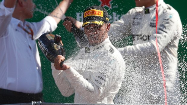Mercedes driver Lewis Hamilton celebrates winning the Italian Grand Prix on Sunday.
