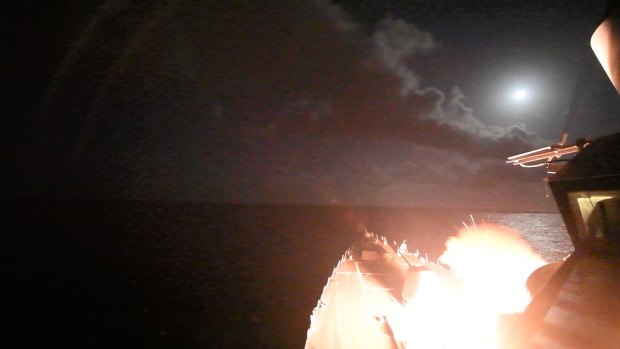 The guided-missile destroyer USS Porter (DDG 78) launches a Tomahawk land attack missile towards Syria on Friday.