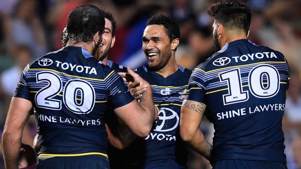 Playing like premiers: The Cowboys celebrate one of many tries against Souths.