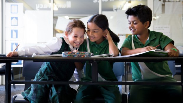 Year 3 students from St. Anthony's in Girraween (from left) Zoe Atkinson, 8, Mokshada Rane, 8, and Aryan Sawant, 8 sit down to their 2016 NAPLAN tests.