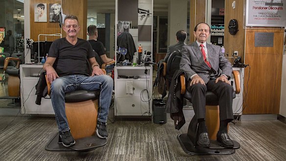 Vince Coletta (right) with his protege Frank Pelli. When Roselands shopping centre opened in 1965 his barbers wore white jackets with black bow ties and sharpened their razors on leather strops.