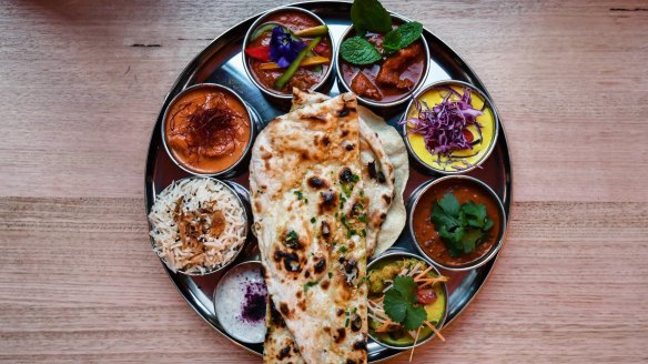 The vibrant thali tray of curries is just one course of the tasting menu. 