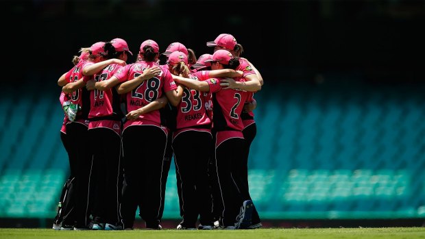 Television stars: Sixers players huddle during the Women's Big Bash League match against the Perth Scorchers.