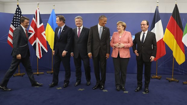 From left to right: Italian Prime Minister Matteo Renzi, British Prime Minister David Cameron, Ukrainian President Petro Poroshenko, US President Barack Obama, German Chancellor Angela Merkel and Franch President Francois Hollande after talks at the Warsaw NATO Summit on Saturday.