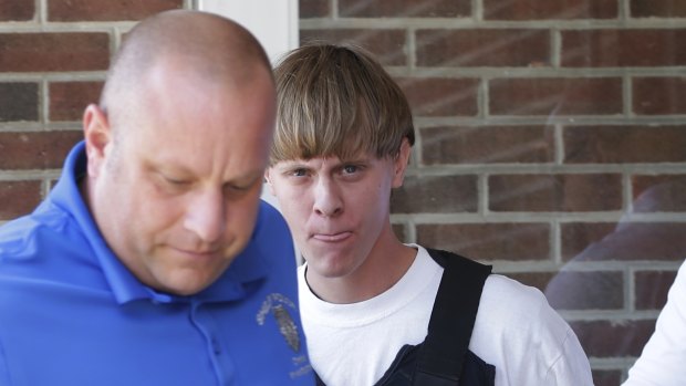 Dylann Roof, right, was allowed to buy a gun used to slaughter nine churchgoers in South Carolina in 2015. 