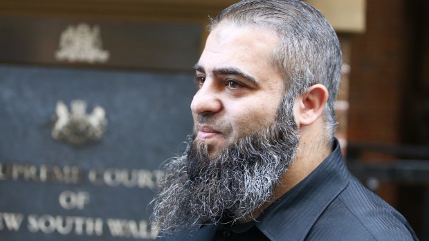 Hamdi Alqudsi, who is accused of recruiting people to fight with terrorists overseas, leaves the NSW Supreme Court after a change in his bail conditions.