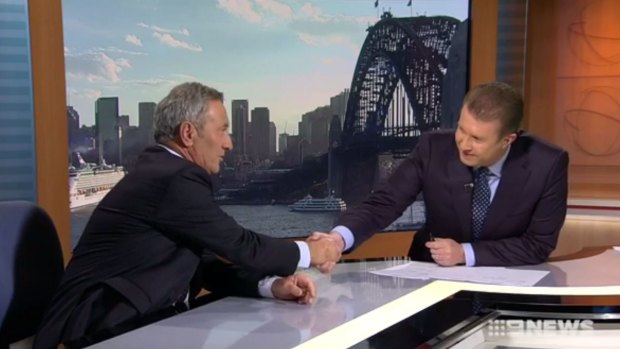Ken Sutcliffe and Peter Overton share a moment on Nine News.