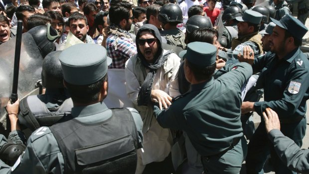 Police forces clash with protesters on Friday.