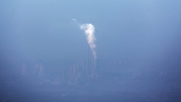 Smoke rises from a stack at a thermal power plant shrouded in smog in Beijing, China, earlier this month.