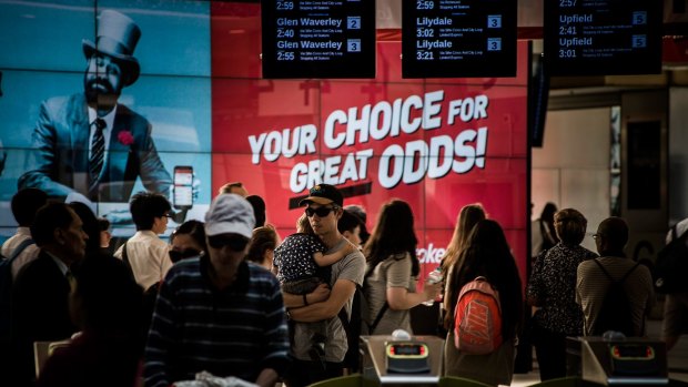 Ladbrokes sports betting agency advertising at Flinders Street station in 2015.