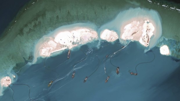 Satellite images have revealed that construction work has been going on on three reefs.