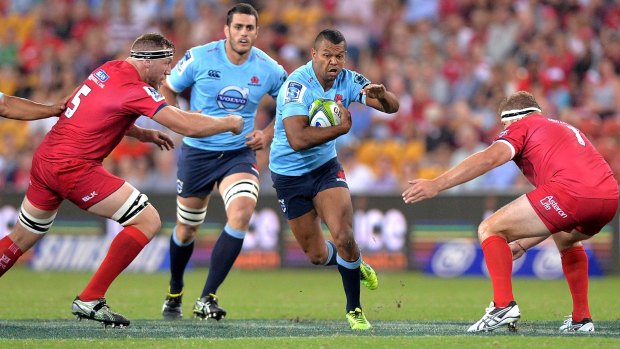 Pressure on: Kurtley Beale runs through a yawning gap in the Reds' defence.