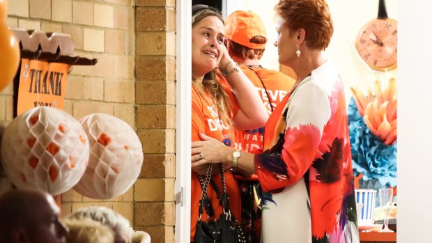 Senator Pauline Hanson consoles supporters.