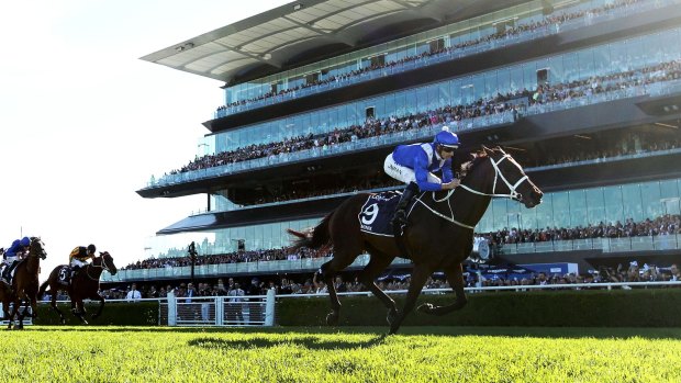 All business: Hugh Bowman and Winx cruise to the line in the Queen Elizabeth Stakes at Randwick on Saturday. 