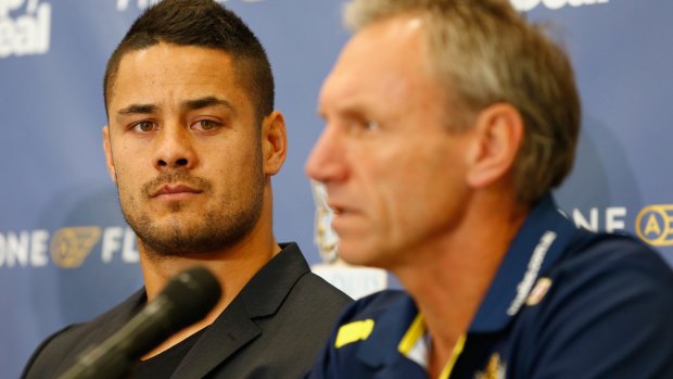 Caught in a conflict: Jarryd Hayne with Titans coach Neil Henry.