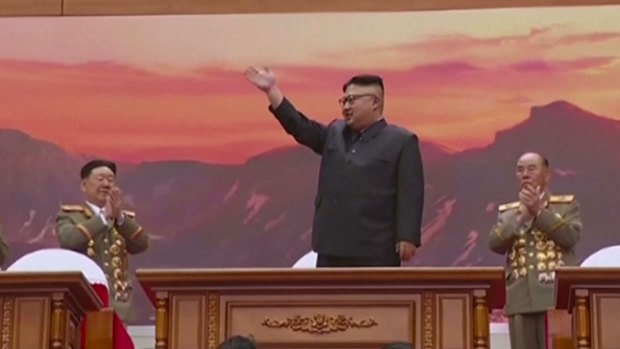 North Korea's leader Kim Jong-un waves at a performance on Sunday.