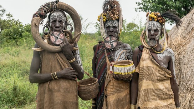 The tribes of Ethiopia's Omo Valley, who practice a particularly exotic form of body art, are now dressing up solely for the camera-toting tourists rolling into their villages