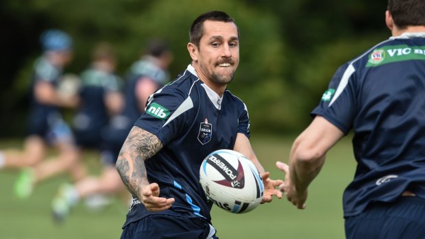 Focused: Mitchell Pearce during a training warm-up in Coffs Harbour on Wednesday as the NSW Blues squad  prepares for Origin II in Melbourne next week.