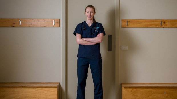 At work: Western Bulldogs player and doctor Tiarna Ernst in her hospital scrubs