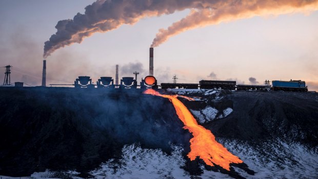 Molten ore is poured into a storage area at a copper factory in Norilsk.