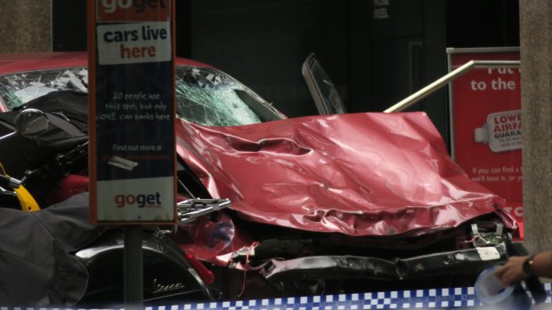 The crumpled car at the scene in Bourke Street after the carnage.