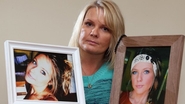 Jenny Doyle holds photos of her daughter Kara who was killed by Mehmet Torun.  