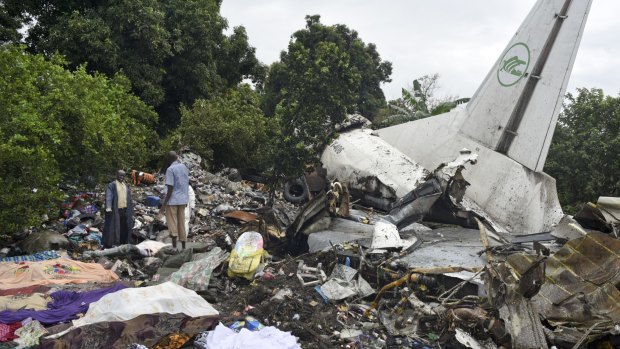 Responders pick through the wreckage of a cargo plane which crashed in  Juba, the capital of South Sudan.