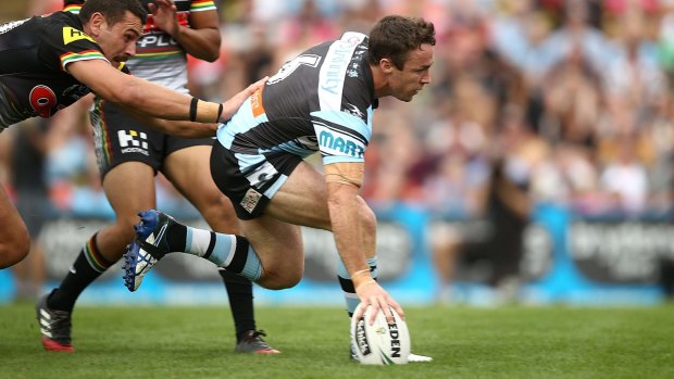 Pivotal: James Maloney crosses the stripe for the Sharks.