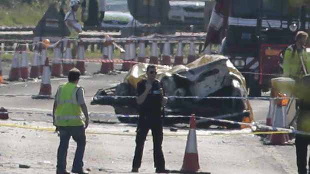 Deadly crash: Emergency services closed off the A27 after a plane crashed into cars.