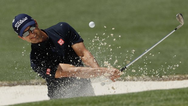 On Target: A rare Adam Scott bunker shot during the third round of the US Masters. The Australian hit 15 of 18 greens as part of a three-under 69.