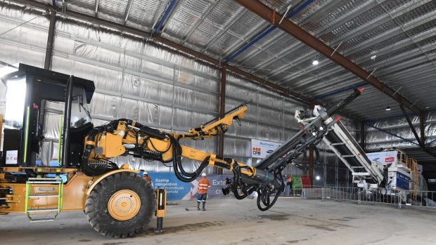 The first excavating equipment for the WestConnex tunnels makes its way down a ramp at Concord on Monday. 