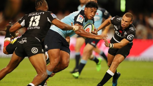 Irae Simone of the NSW Waratahs on attack against the Sharks.
