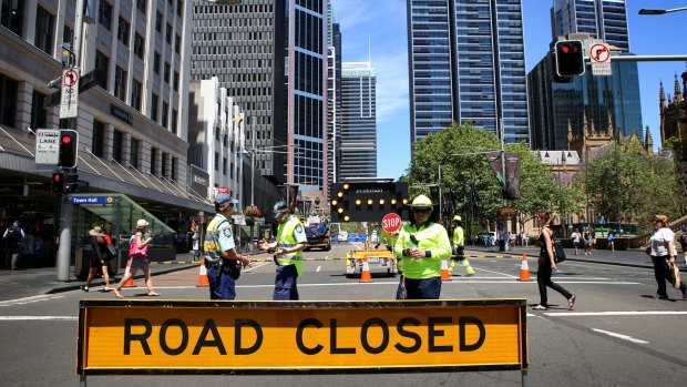 Construction workers organise the implementation of the light rail system in the CBD.