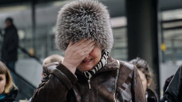 A woman weeps on the weekend near a "memorial" to the victims of the Airbus A321 crash in St Petersburg. 