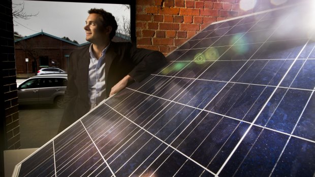 Sun Edison Australia managing director Jeremy Rich with a solar panel which his company will install for free. The company  then sells the power back to the household at a rate that, on average, is about 50 per cent cheaper than the grid.