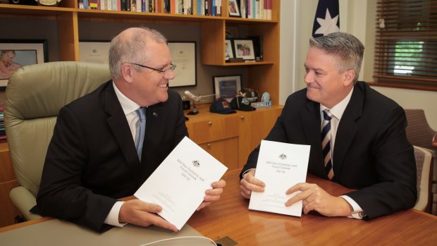 Treasurer Scott Morrison and Minister for Finance Mathias Cormann in the Treasurer's office at Parliament House on Monday.