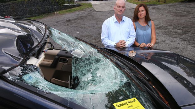 No warning: Colin Bird and Suzanne Latham, "lucky to be alive" after a rock fell on their car.