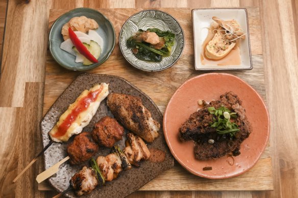 Tori set with miso, yakitori, fried chicken and little plates of pickles.