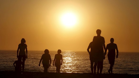 Swimmers get an early start at Coogee Beach before a predicted 38-degree day in Sydney.