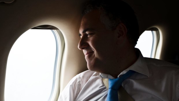 Treasurer Joe Hockey on board a private plane in 2013.