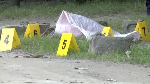 Evidence markers are used where Japanese national Kunio Hoshi was shot and killed.