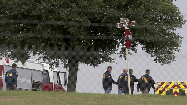 FBI agents near the scene of the shooting at Joint Base San Antonio-Lackland.