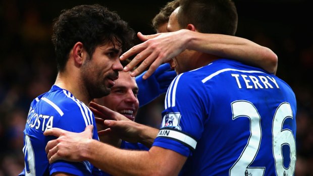 Boxing Day strike: Chelsea teammates congratulate Diego Costa following his goal against London rivals West Ham United.