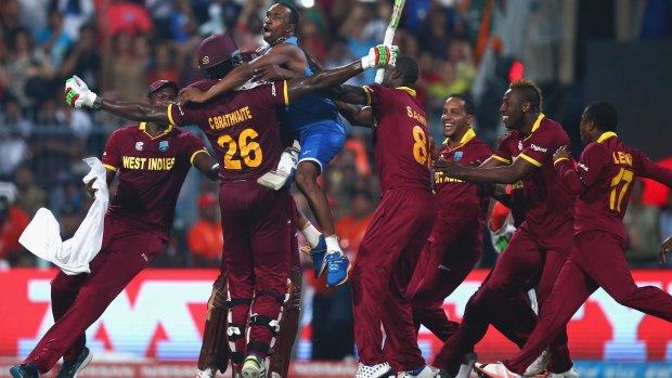 King Carlos: Jubilant teammates mob Carlos Brathwaite after his thunderous hitting won the West Indies the T20 World Cup final last year.
