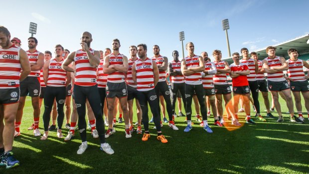 Sydney Swans players stand together united during the press conference regarding Adam Goodes playing future. 