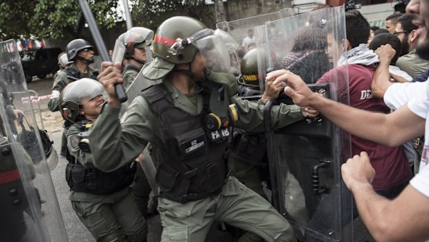 Protesters clash with police. 