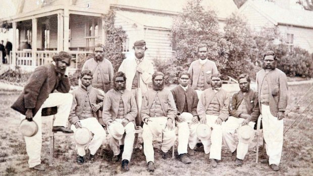 The Aboriginal team on Boxing Day, 1866, outside the MCG. The man at the back wearing a cap is Tom Wills.