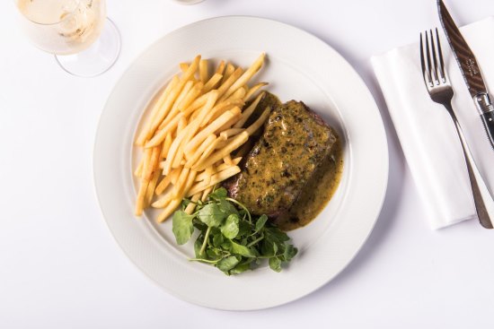 Grilled sirloin, cafe de paris butter and frites at Bistro Moncur, Woollahra.