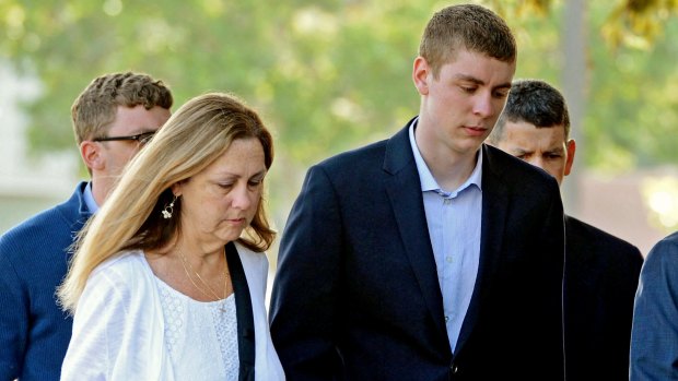 Brock Turner, right, attends court. 